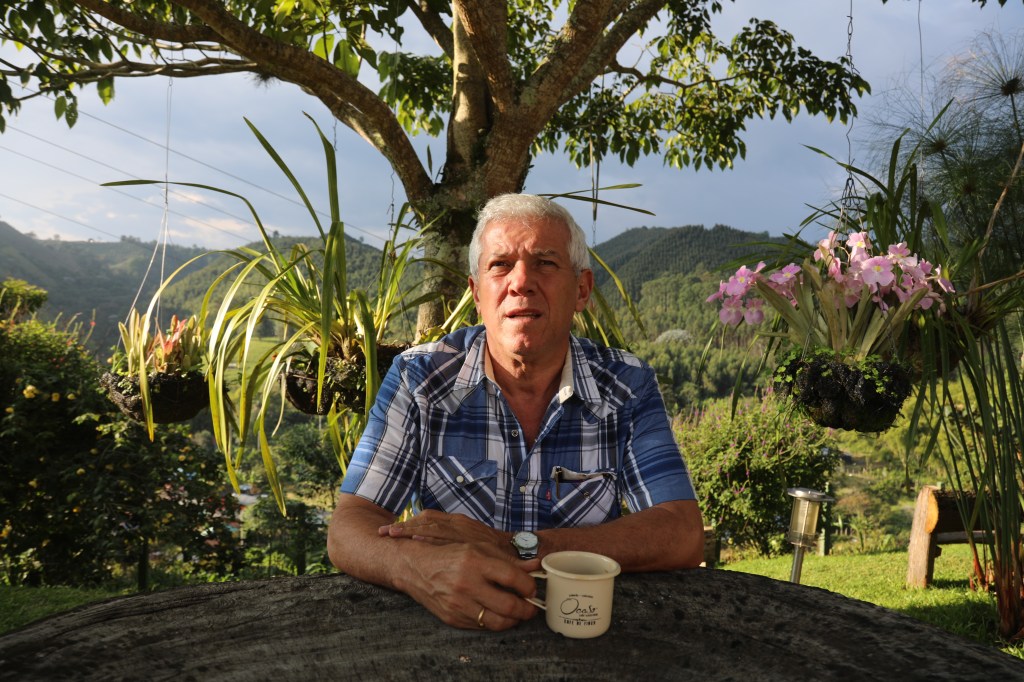 Gustavo Patiño drinks coffee on his farm in Colombia.