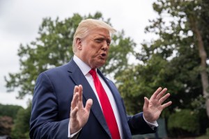 President Donald Trump speaks with reporters as he walks to Marine One on the South Lawn of the White House, Friday, July 31, 2020, in Washington.