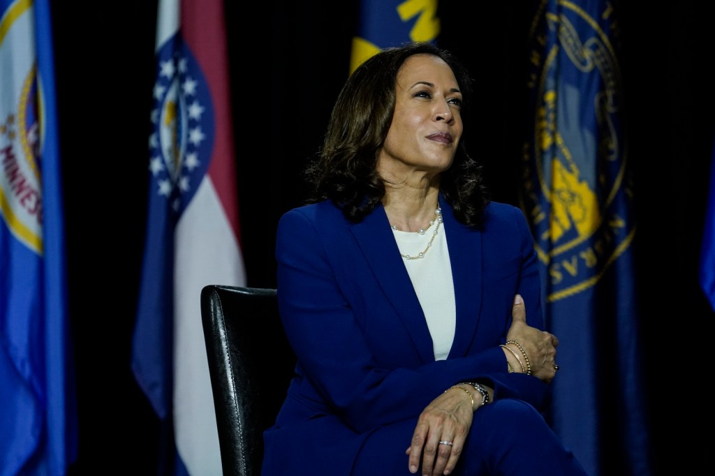 Sen. Kamala Harris listens to Joe Biden make remarks at the Alexis Dupont High School on August 12, 2020 in Wilmington, Delaware.