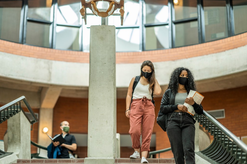 Students on Going Back to School During the Pandemic: photo of college students in masks