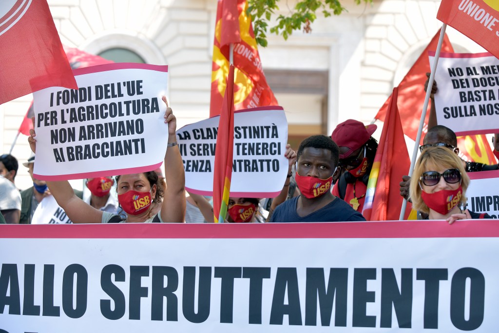 Migrant farm workers, allied to the USB union, protest in Esquilino Square.