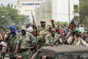 Crowds cheer as soldiers parade in vehicles