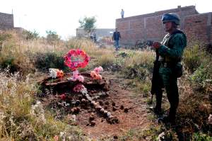 A soldier secures the area where a clandestine mass grave was discovered at Lomas del Vergel in the community of Zapopan, Jalisco state, Mexico, on January 16, 2020.