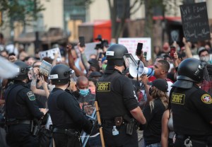 People gather in front of the Kenosha County Court House to protest against the police shooting of Jacob Blake on August 24, 2020 in Kenosha, Wisconsin.