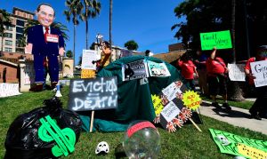 Renters facing risk of evictions and their supporters protest as they demand developer Geoffrey Palmer to cancel their rent on July 31, 2020 in Los Angeles. (Photo by Frederic J. BROWN / AFP) (Photo by FREDERIC J. BROWN/AFP via Getty Images)