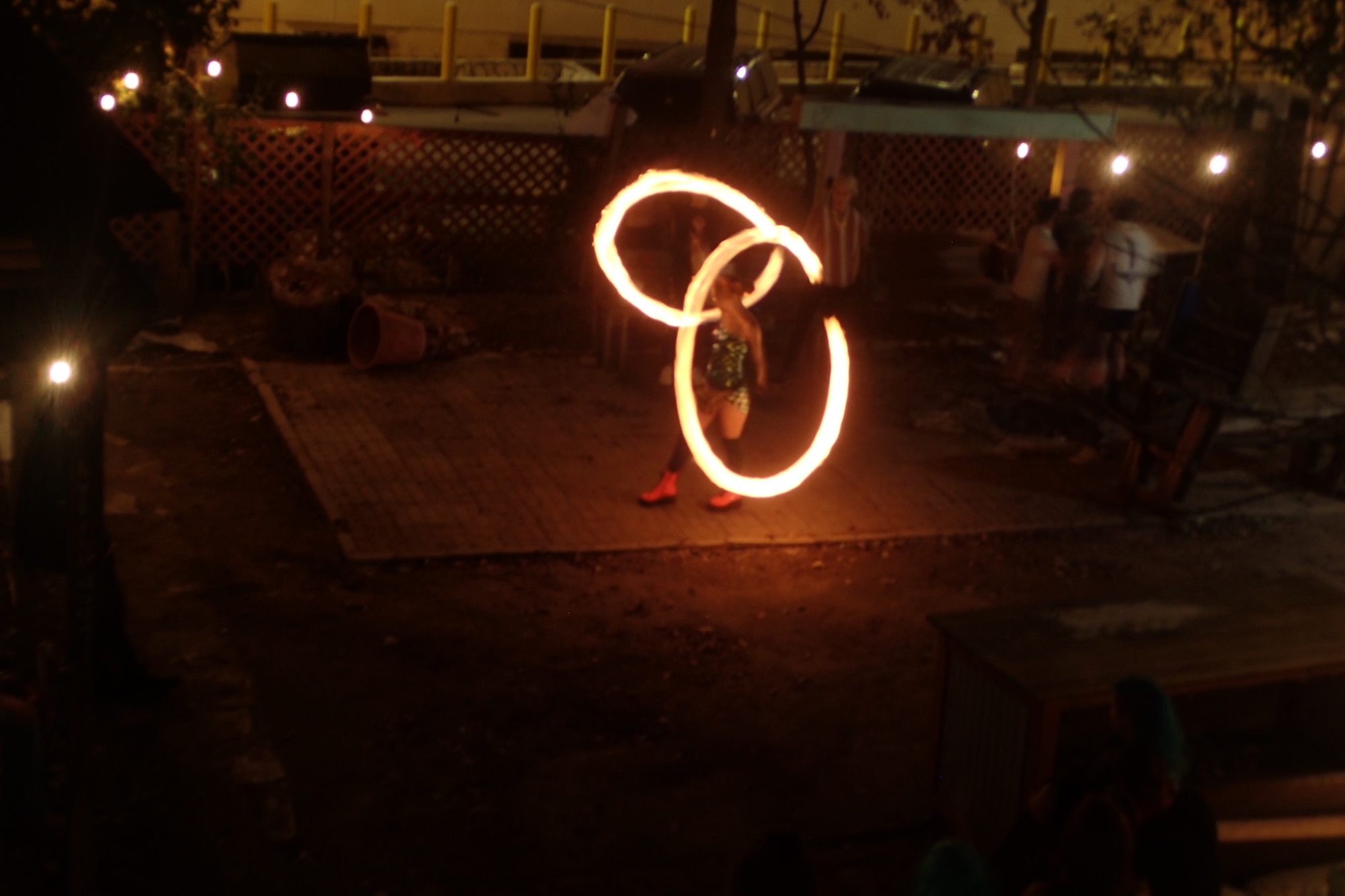 A fire dancer on the deck at 21st Street, pre-COVID-19. Photo by Laura Ullman.