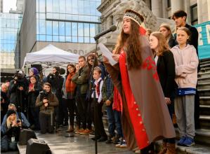 A group of young people announce it is suing the federal government over climate change during a climate strike in Vancouver last October. Swedish climate activist Greta Thunberg, right, looks on