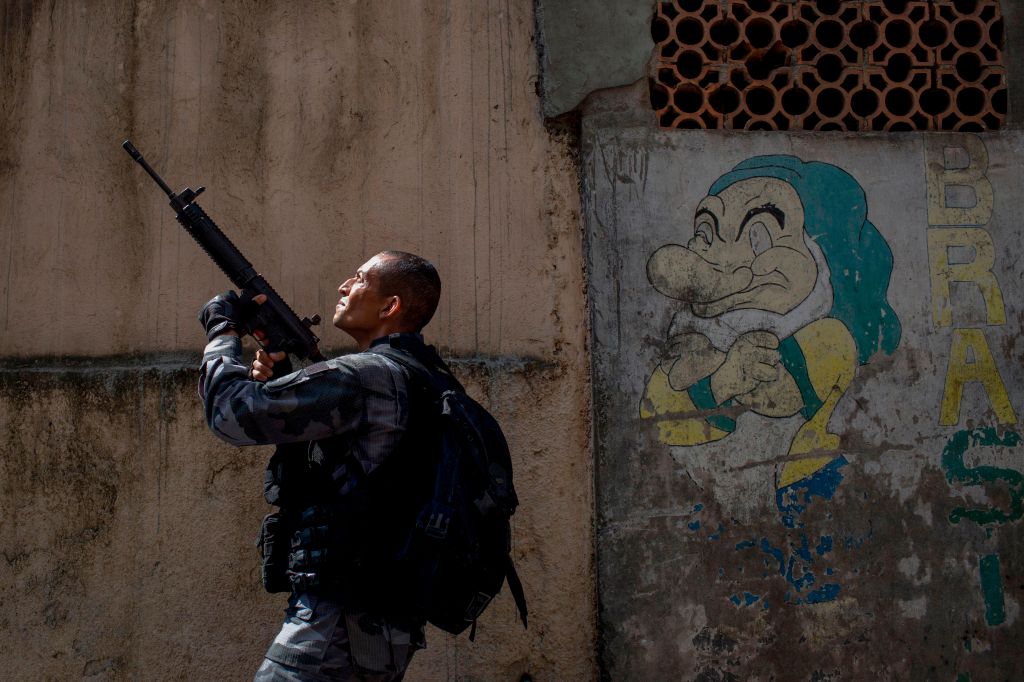 A member of the military police patrols during an operation in the Rocinha favela in Rio de Janeiro, Brazil on January 25, 2018.