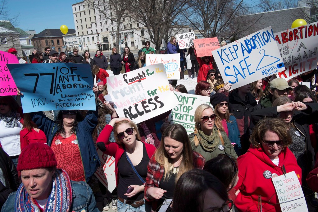 Pro-choice demonstrators rally at the New Brunswick Legislature in Fredericton in April 2014