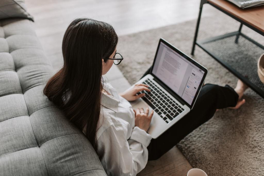 girl reading on laptop