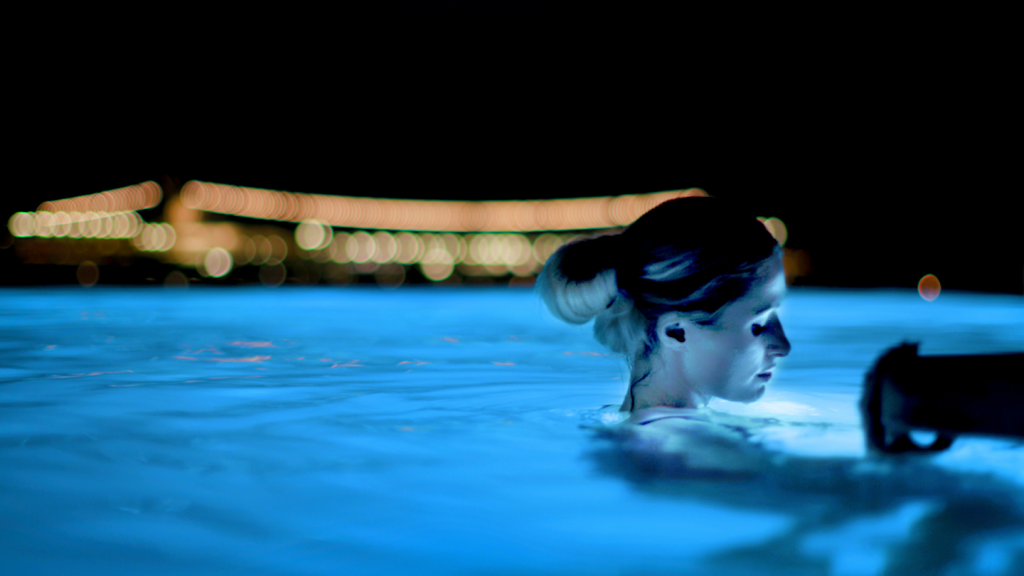 Paris Hilton in a pool at night in Mykonos in a scene from 'This Is Paris'