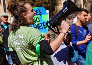 Michael Jacobs during a climate protest, unrelated to the one where he was arrested and allegedly assaulted. (Photo courtesy of Michael Jacobs)