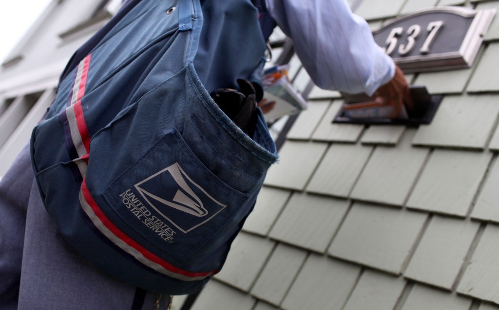 Mailman delivering mail