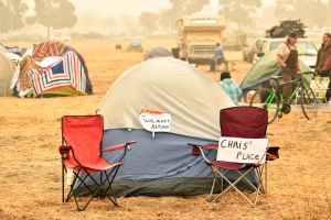 A makeshift address is seen on a tent at an evacuee encampment in a Walmart parking lot in Chico, California