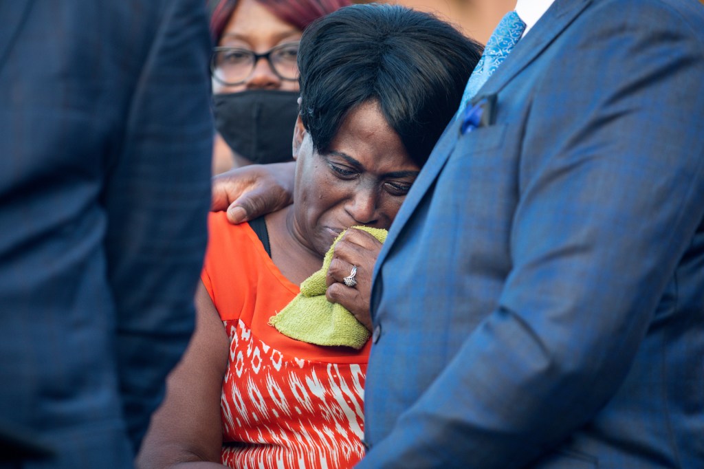 Marcella Louis cries during a candle light vigil in honor of her son Jonathan Price on October 5, 2020 in Wolfe City, Texas.