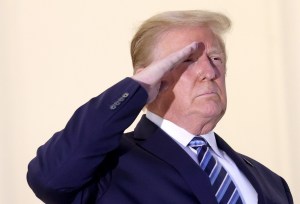 U.S. President Donald Trump salutes Marine One helicopter pilots after returning to the White House from Walter Reed National Military Medical Center on October 05, 2020 in Washington, DC.