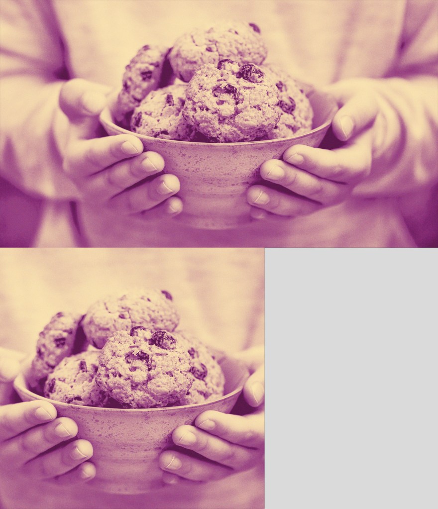 a pair of hands holding a bowl full of cookies