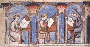 A group of monks copy out pages in a medieval scriptorium.