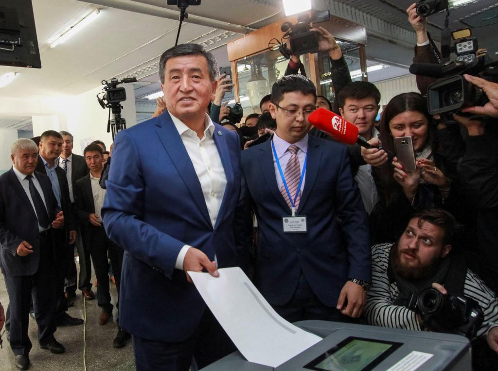 Presidential candidate Sooronbai Jeenbekov casts his ballot at a polling station during the presidential election in Bishkek​.