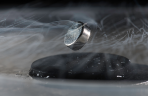 Magnetic levitation displayed by a cold superconductor. Image: University of Rochester photo/ J. Adam Fenster​