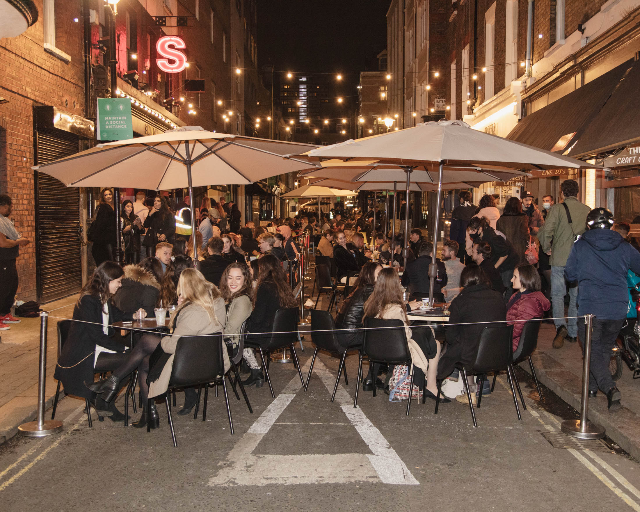 Outdoor drinkers in Soho in London one the last night before new Tier 2 lockdown measures