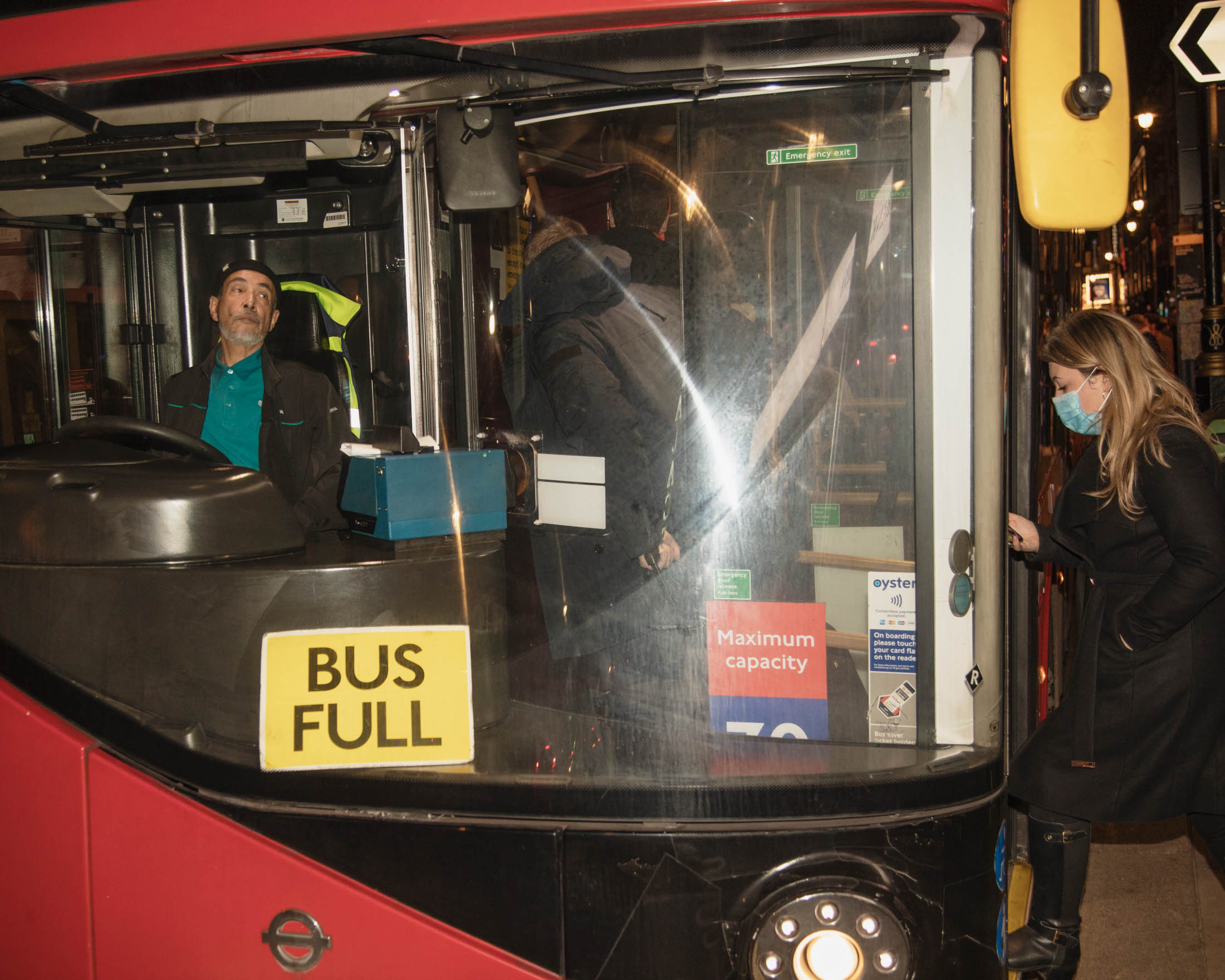 Bus full sign in Soho in London one the last night before new Tier 2 lockdown measures