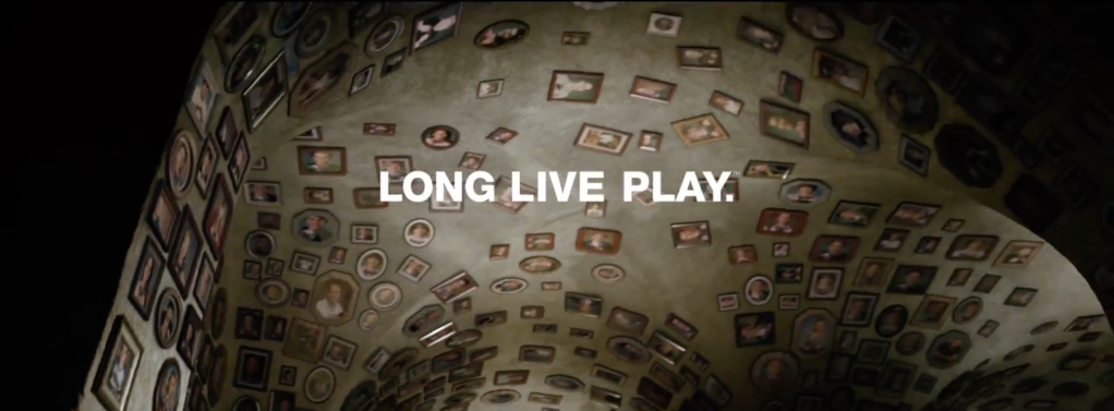 A ceiling decorated with the faces of PlayStation gamers with the legend "Long Live Play" superimposed over the frame.