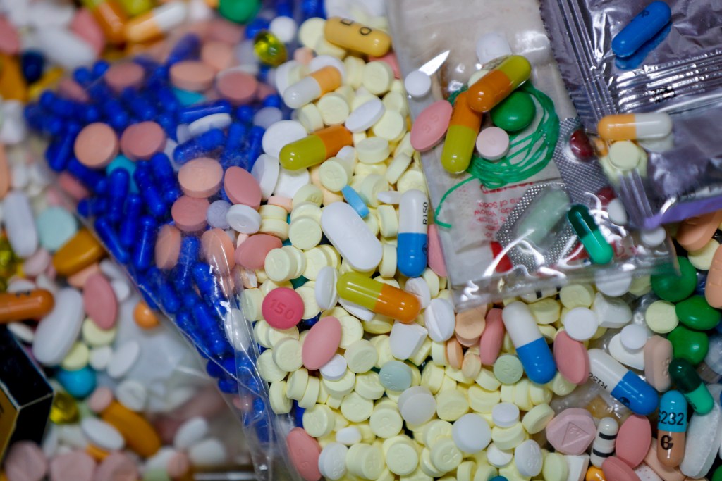 FILE - In this Sept. 11, 2019, file photo, medications slated for destruction are shown in a locked storage area of the police department in Barberton, Ohio. The tentative settlement involving the opioid crisis and the maker of OxyContin, Purdue Pharma, c