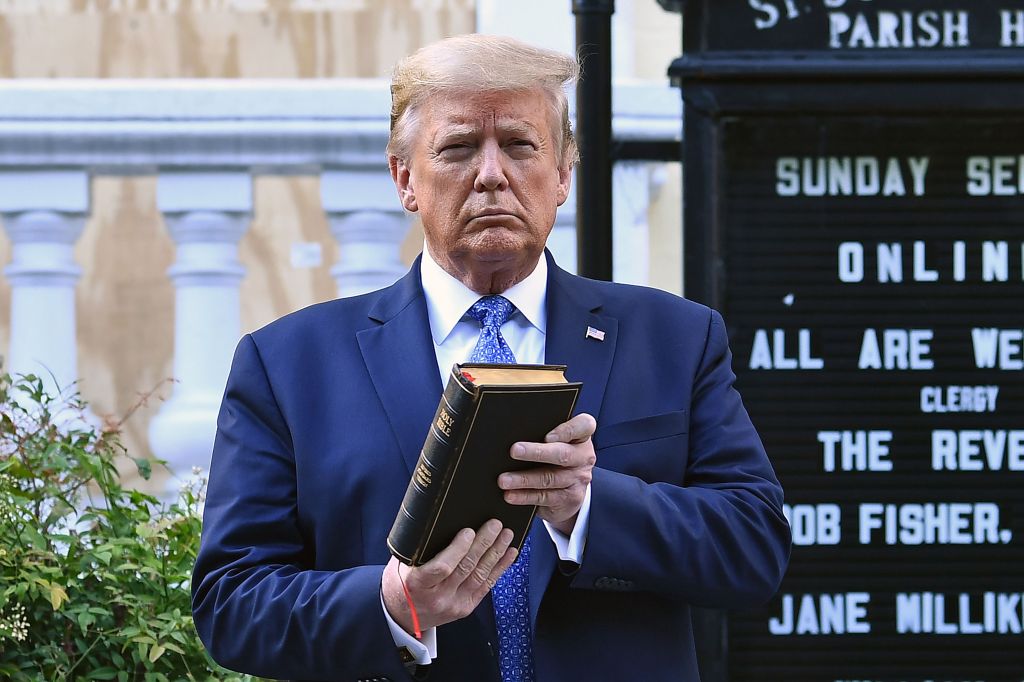 US President Donald Trump holds up a Bible outside of St John's Episcopal church across Lafayette Park in Washington, DC on June 1, 2020.