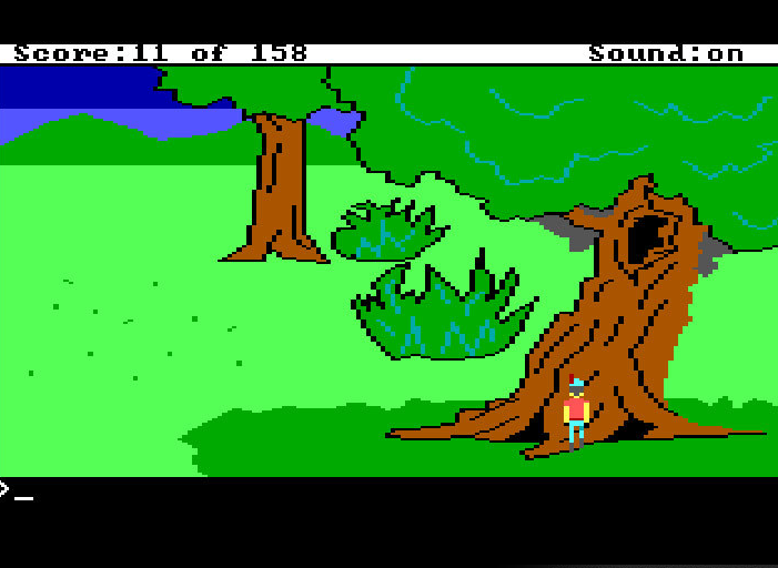 A screenshot of the crude graphics of King's Quest 1, showing a man walking straight into a tree trunk.