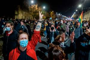 Protestors shout slogans as they are blocked by riot police guarding the house of Jaroslaw Kaczynski, leader of Poland's ruling Law and Justice party (PIS) during a demonstration against a decision by the Constitutional Court on abortion law restriction i