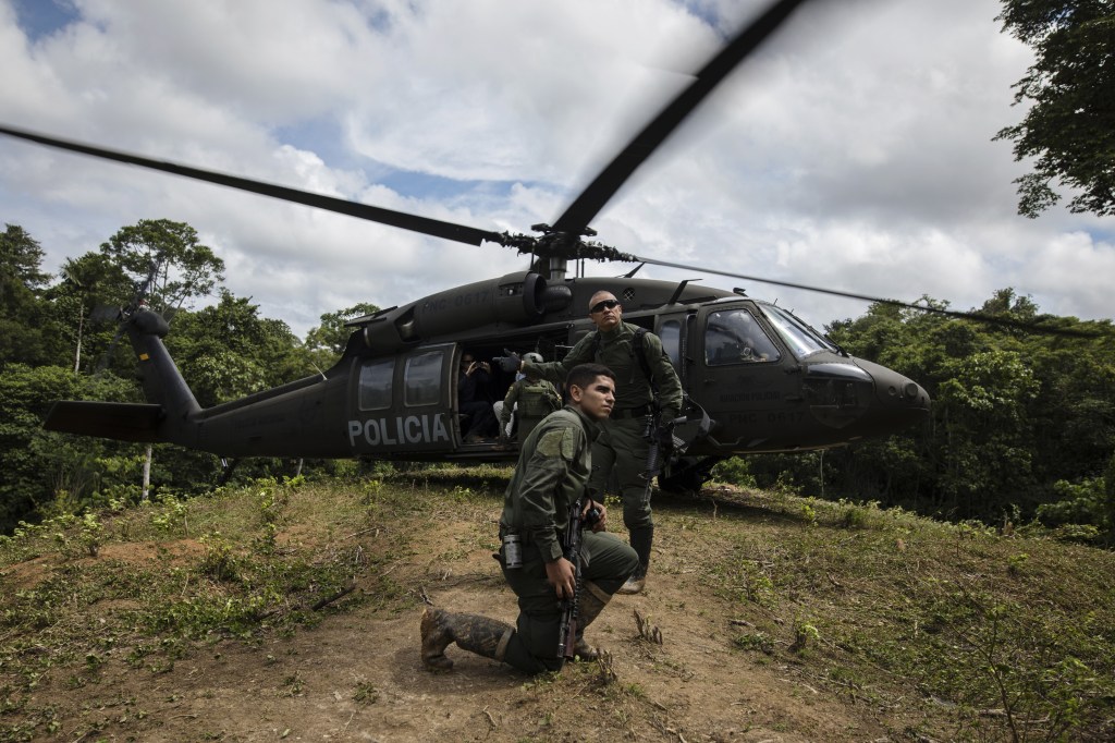 Colombian police land a helicopter near illegal coca plantations in Tumaco, Colombia