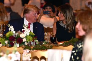 US President Donald Trump and First Lady Melania Trump attend a Christmas Eve dinner with his family at Mar-A-Lago in Palm Beach, Florida on December 24, 2019.