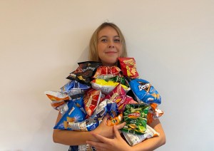 woman with bags of crisps