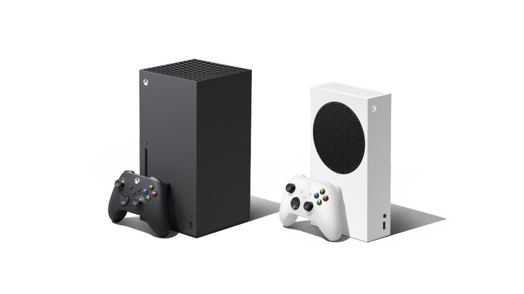 The two Xboxes, standing at angles next to each other.