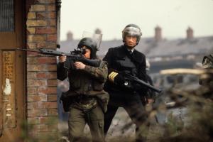 A British soldier and an armed Royal Ulster Constabulary officer in Belfast, Northern Ireland in the 1980s