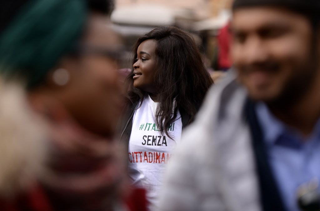 A woman takes part in a protest demanding reform of the citizenship law in Italy, in Rome in February 2017