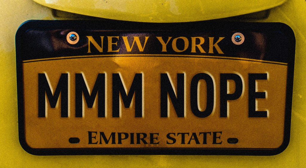 a license plate that says mmm nope