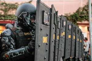 Riot forces stand guard during a protest on June 7, 2020 amid the COVID-19 pandemic.