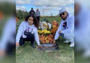 Seth Maclean's sister and brother Taliyah Francis (left) and Lamar Maclean (right) at his gravestone.