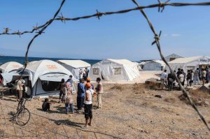 Refugees gather at a camp in Greece.