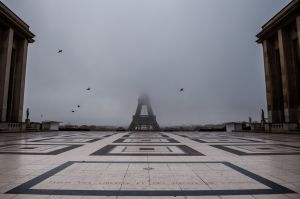 The empty Trocadero esplanade and the Eiffel Tower partially hidden by fog in Paris, as France entered a second lockdown.