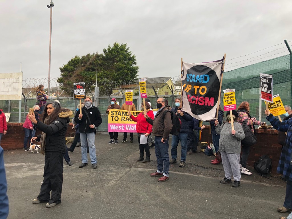 Stand Up to Racism holds a demonstration to welcome asylum seekers staying in Penally Training Camp to Wales.