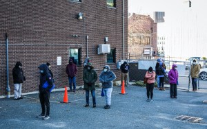 People weathered through long lines at Harvard Street Neighborhood Health Center, despite temperatures in the 30s, to get tested for Covid-19