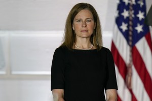 Amy Coney Barrett, associate justice of the U.S. Supreme Court, stands during a ceremony on the South Lawn of the White House in Washington, D.C., U.S., on Monday, Oct. 26, 2020.