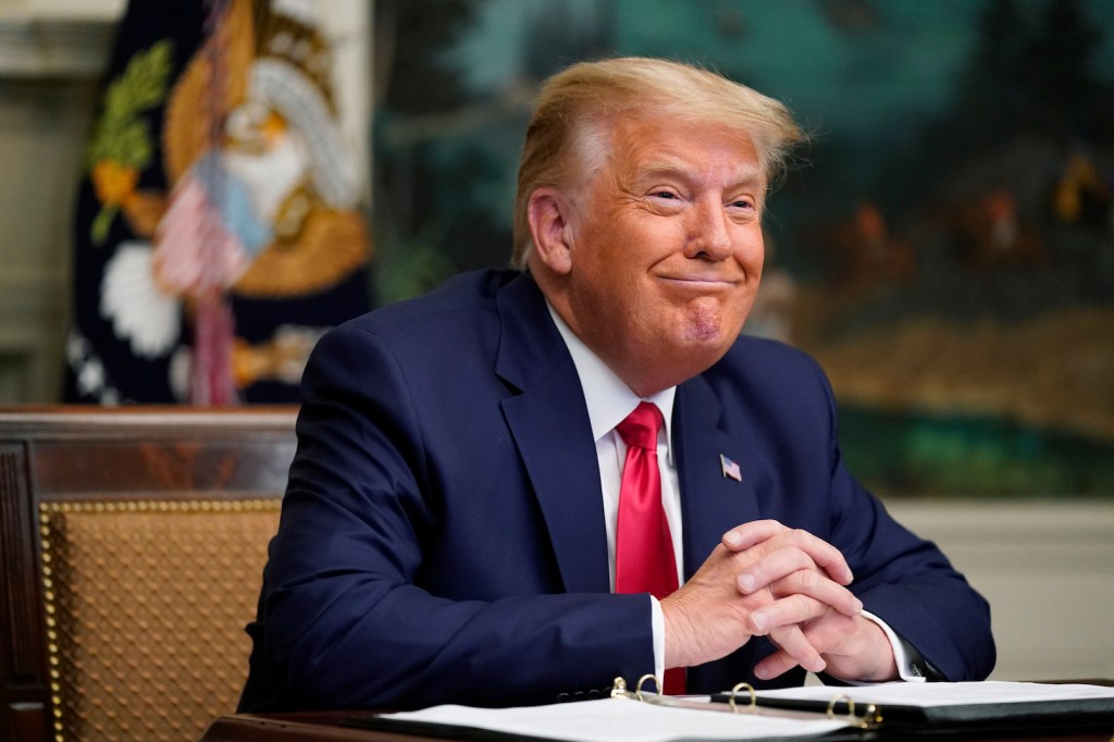 President Donald Trump participates in a video teleconference call with members of the military on Thanksgiving, Thursday, Nov. 26, 2020, at the White House in Washington.