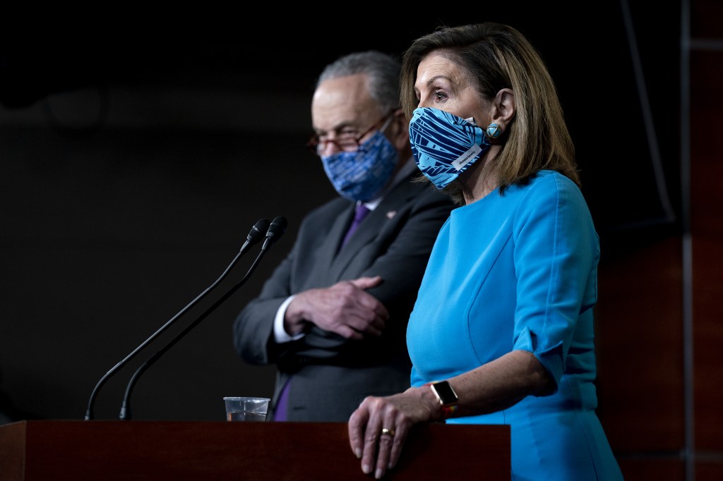 U.S. House Speaker Nancy Pelosi with Senate Minority Leader Chuck Schumer at a news conference.