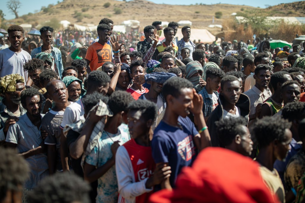 Refugees queue for food distribution in Um Rakuba refugee settlement in Eastern Sudan.