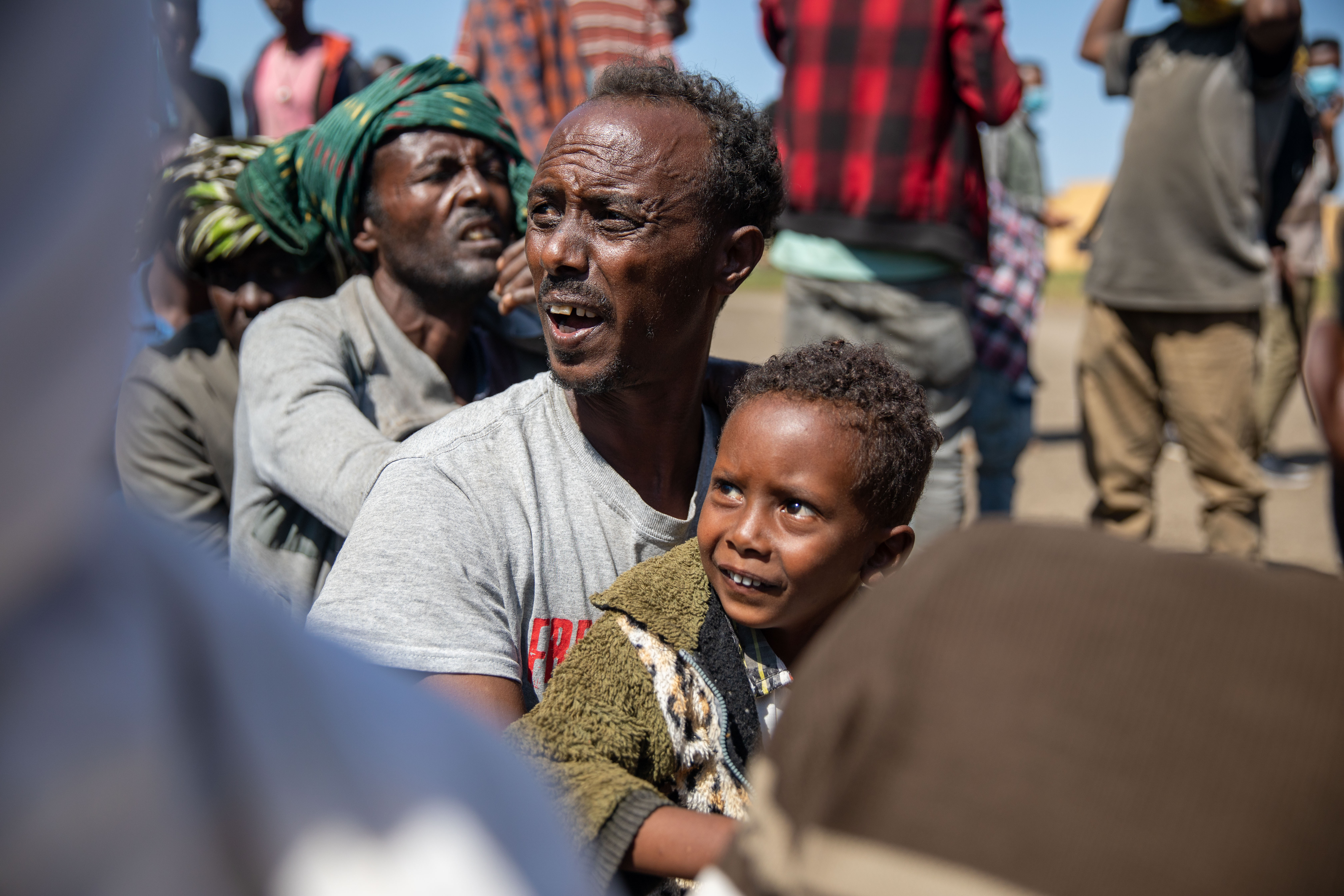 New arrivals Lakey Fasein (father) and 5 year old Nimar. Refugees arrive at Village 8 refugee settlement in Eastern Sudan.