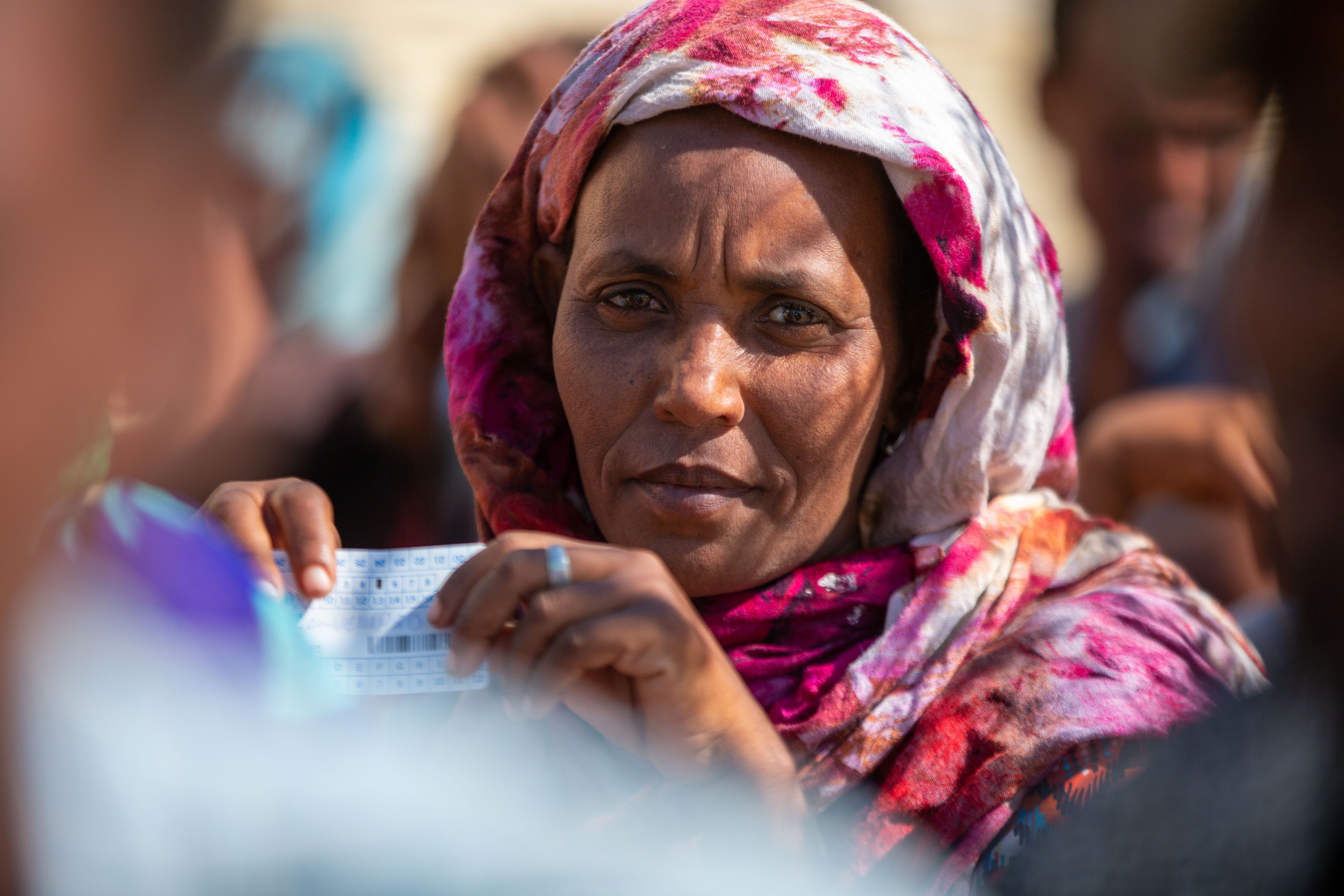 A refugee queues to register.